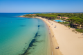 Budoni Sardegna - spiaggia di Agrustos con mare turchese e pini mediterranei